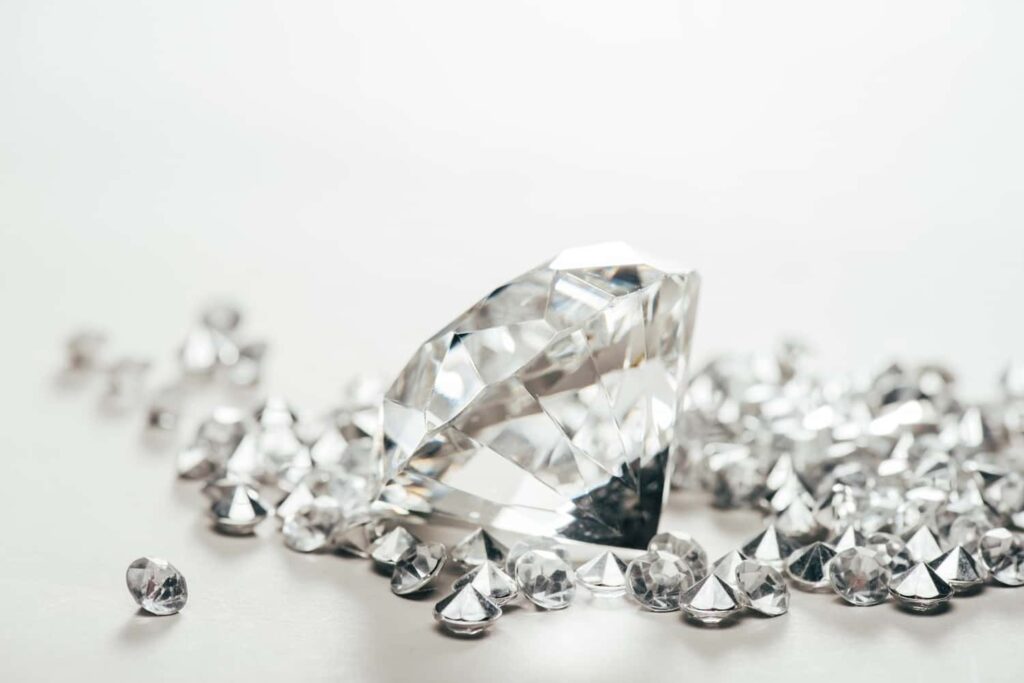 Loose brilliant cut diamond being examined by a Kelowna diamond buyer